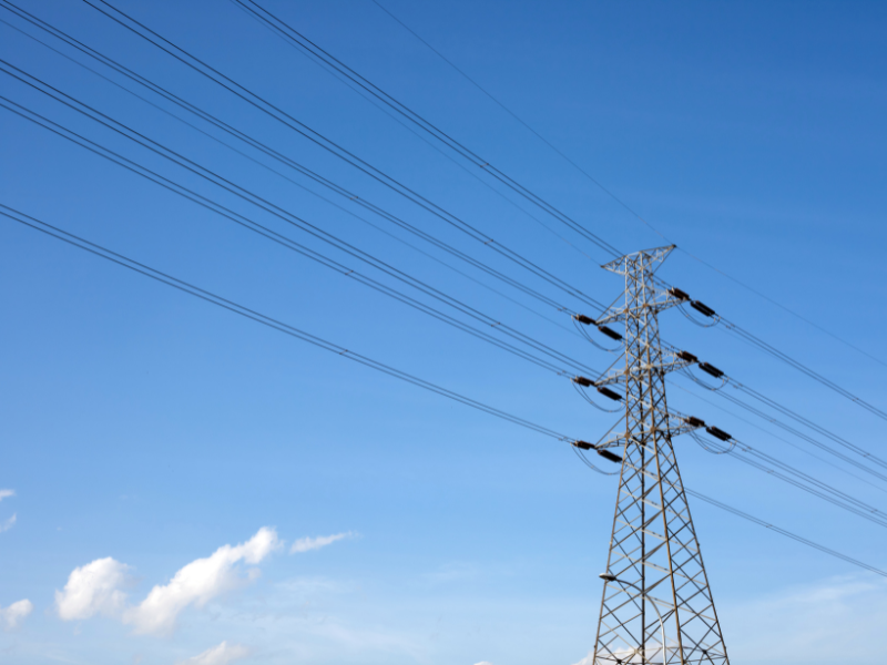 power lines with blue sky in background